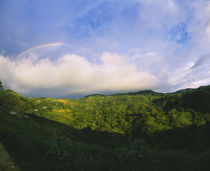 Clouds and rainbow over a mountain, Costa Rica by Panoramic Images