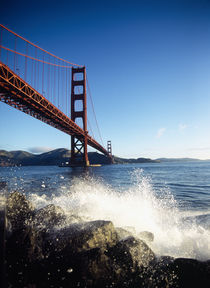 Low angle view of a bridge across the sea by Panoramic Images