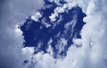 Billowing white clouds, heart shape, blue sky. von Panoramic Images