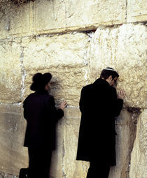 Two men praying in front of a wall, Western Wall, Old City, Jerusalem, Israel von Panoramic Images