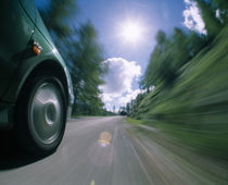 Car moving on the road by Panoramic Images
