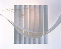 Vertical white cylinders behind horizontal floating ribbons  by Panoramic Images
