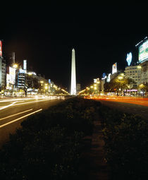 Obelisk lit up at night in a city von Panoramic Images