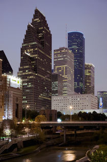 Buildings lit up at night, Wortham Theater Center, Houston, Texas, USA by Panoramic Images