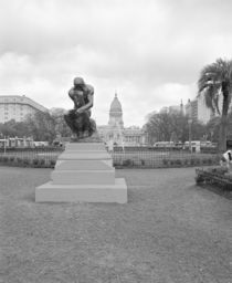 Statue of the thinker in a formal garden by Panoramic Images