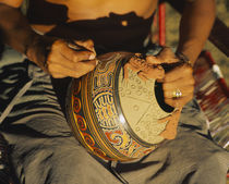 Mid section view of a person etching a pottery, Costa Rica by Panoramic Images