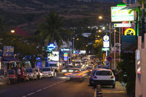 Traffic on a street at night by Panoramic Images