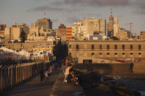 People on a pier, Escollera Sarandi, Montevideo, Uruguay by Panoramic Images