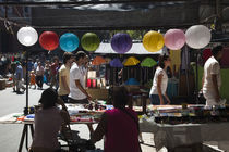 People shopping in a street market by Panoramic Images