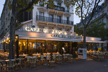 Chairs and tables in a restaurant at dawn von Panoramic Images