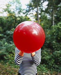 Close-up of a woman blowing a balloon, Germany von Panoramic Images
