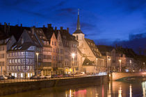 Buildings lit up at dusk, St. Nicholas Church, Alsace, Strasbourg, France by Panoramic Images