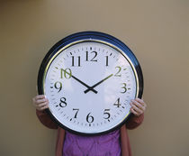 Mid section view of a person holding a clock, Germany by Panoramic Images