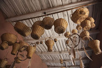 Wicker baskets and dreamcatchers hanging in a restaurant von Panoramic Images