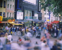 Crowd standing in front of a movie theater, Theater District, London, England von Panoramic Images