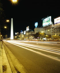 Obelisk lit up at night in a city von Panoramic Images