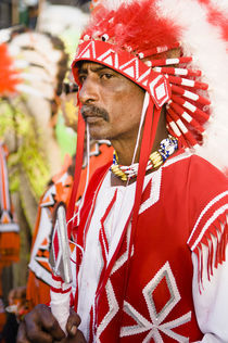 Man dressed as a Native American in the Port of Spain carnival in Trinidad. by Tom Hanslien