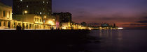 Buildings lit up at the waterfront, Malecon Avenue, Havana, Cuba by Panoramic Images