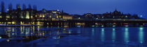 Buildings in a city lit up at night, Sodermalm, Slussplan, Stockholm, Sweden von Panoramic Images