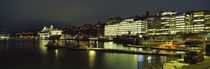 Buildings in a city lit up at night, Sodermalm, Slussplan, Stockholm, Sweden von Panoramic Images