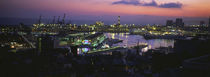 High angle view of city at a port lit up at dusk, Genoa, Liguria, Italy by Panoramic Images