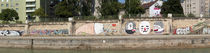 Graffiti on a wall at the riverside, Wien River, Vienna, Austria by Panoramic Images