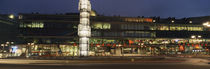 Buildings in a city lit up at dusk, Sergels Torg, Stockholm, Sweden von Panoramic Images