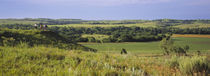 Three mountain bikers on a hill, Kansas, USA by Panoramic Images