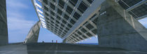 Four people under a structure, Barcelona, Catalonia, Spain von Panoramic Images