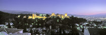 High angle view of a castle lit up at dusk, Alhambra, Granada, Andalusia, Spain by Panoramic Images
