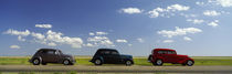 Three Hot Rods moving on a highway, Route 66, USA by Panoramic Images