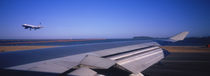 Commercial airplane taking off from a runway, San Francisco, California, USA by Panoramic Images