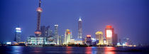 Buildings lit up at dusk, Shanghai, China by Panoramic Images