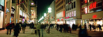 Buildings in a city lit up at night, Munich, Germany by Panoramic Images