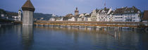 Covered bridge over a river, Chapel Bridge, Reuss River, Lucerne, Switzerland by Panoramic Images