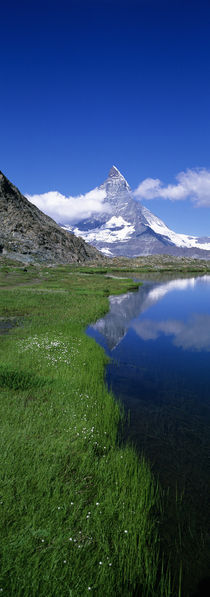 Reflection Of Mountain In Water, Riffelsee, Matterhorn, Switzerland von Panoramic Images