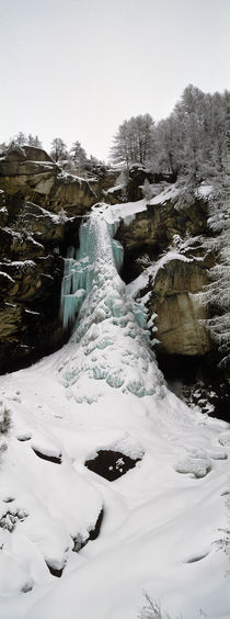 Low angle view of a frozen waterfall, Valais Canton, Switzerland by Panoramic Images