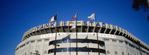 Flags in front of a stadium, Yankee Stadium, New York City, New York, USA by Panoramic Images