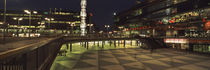 Buildings in a city lit up at night, Sergels Torg, Stockholm, Sweden von Panoramic Images