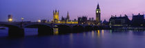 Buildings lit up at dusk, Big Ben, Houses of Parliament, London, England by Panoramic Images