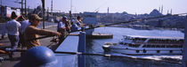 Side profile of fishermen fishing in a river, Galata Bridge, Istanbul, Turkey by Panoramic Images