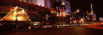 Buildings in a city lit up at night, The Strip, Las Vegas, Nevada, USA by Panoramic Images
