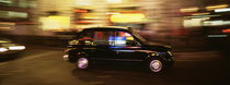 England, London, Black cab in the night von Panoramic Images