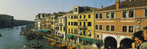 Tourists looking at gondolas in a canal, Venice, Italy by Panoramic Images