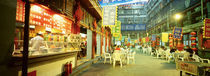 Group of people sitting outside a restaurant, Beijing, China by Panoramic Images
