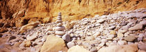 Stack of stones on the beach, California, USA von Panoramic Images