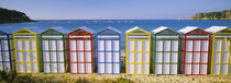 Beach huts in a row on the beach, Catalonia, Spain von Panoramic Images