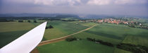 Blade of a wind turbine and a village, Baden-Wurttemberg, Germany by Panoramic Images