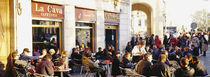 Tourists sitting outside of a cafe, Barcelona, Spain by Panoramic Images