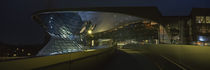 Commercial buildings lit up at night, BMW Welt, Munich, Bavaria, Germany by Panoramic Images